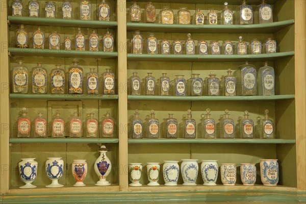 Interior view with rows of bottles sorted on shelves