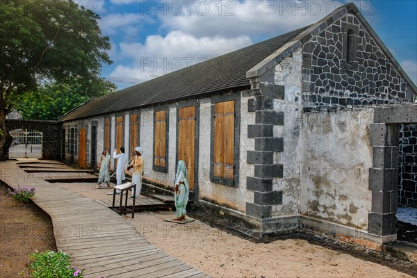 View of grounds Exterior open space beyond historic accommodation slave houses reception camp present day slave museum museum about slavery historic arrival site for accommodation reception camp internment of captured slaves with figures depicting slaves show Port Louis