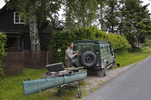 Transporting a boat with a car