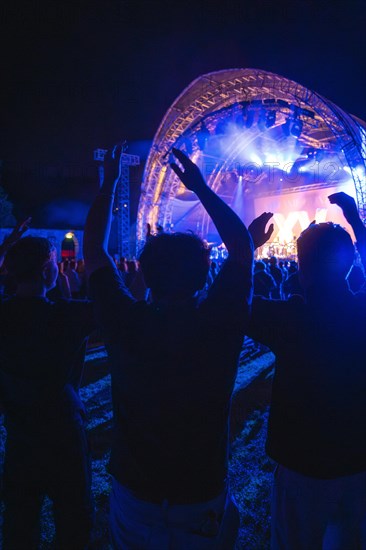 Cheering crowd at Live Klostersommer Festival in Historic Monastery