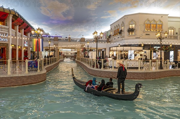 Gondola ride on indoor canal at Villaggio Mall