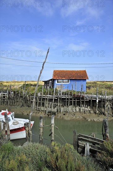 Colourful cabins of oyster farm at la Baudissiere near Dolus