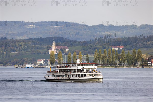Excursion boat KARLSRUHE underway on Lake Constance against the backdrop of Birnau Monastery