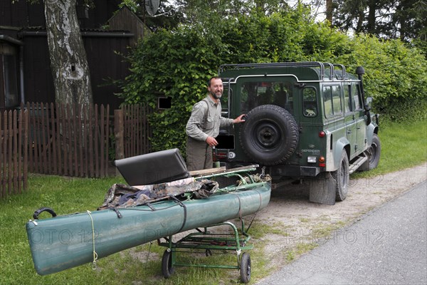 Transporting a boat with a car