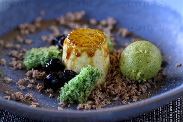 Lemon grass pannacotta with pistachio ice cream at a restaurant