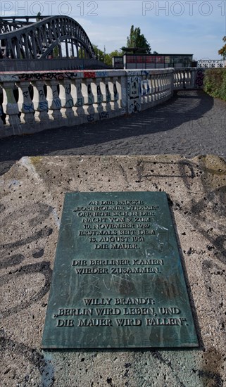 A plaque commemorates the fact that the first border crossing between the two parts of Berlin was opened at Bornholmer Strasse