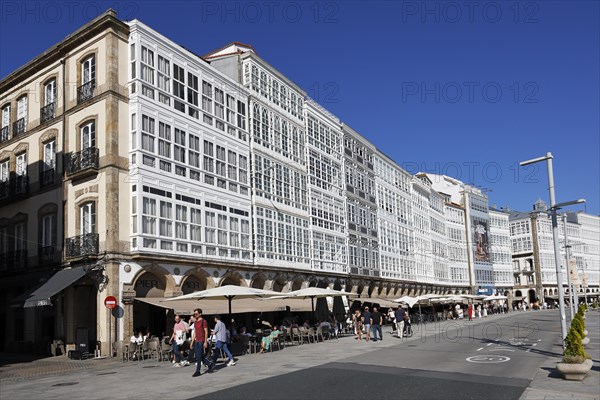 Decorative house facades on the harbour promenade in the historic city centre of La Coruna