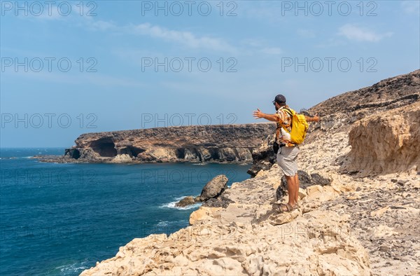 A young tourist on the trail heading to the caves of Ajuy