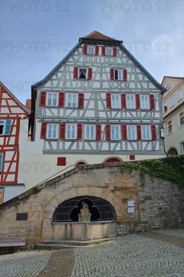 Market square with half-timbered house and market fountain