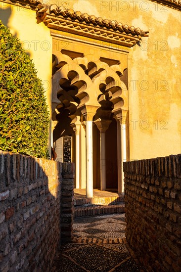 Detail of precious Arabic windows and doors inside the Alcazaba in the city of Malaga