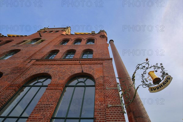 Red brewhouse with chimney and nose shield