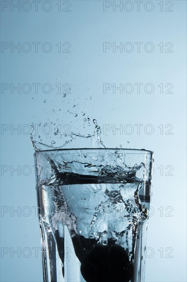 Clear glass with splashing water