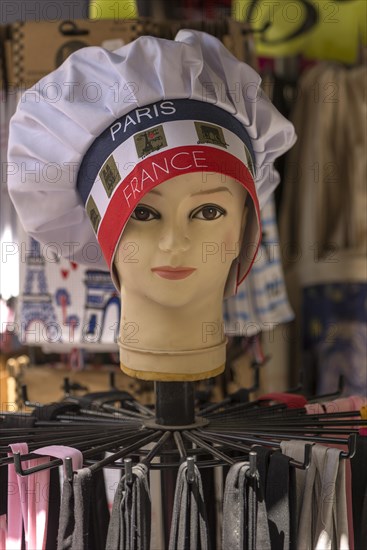 Doll's head with chef's hat in a souvenir shop