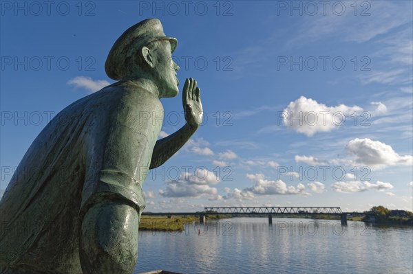 Statue of the Lauenburg Callers on the banks of the Elbe in the old town of Lauenburg on the Elbe. Duchy of Lauenburg