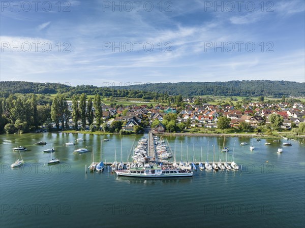 Aerial view of the jetty and marina of the Lake Constance municipality of Iznang on the Hoeri peninsula with the cruise ship MS Reichenau