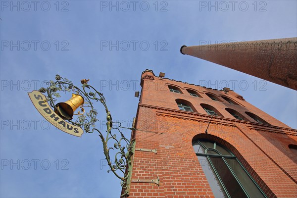 Red brewhouse with chimney and nose shield