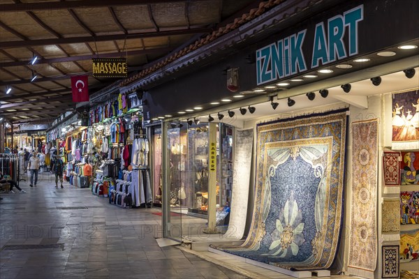 Bazaar in Kusadasi with clothes and carpets