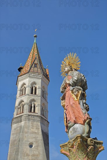 Church tower of the neo-Romanesque St. John's Church and Madonna figure from the market fountain