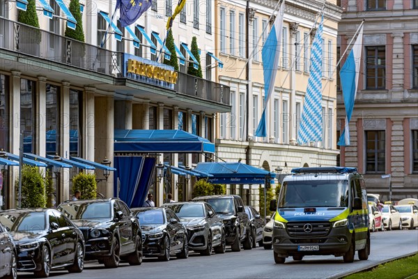 Police squad car at the Hotel Bayerischer Hof with Palais Montgelas