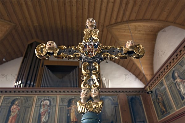 Ornate cross in the late Gothic church of St. John the Baptist
