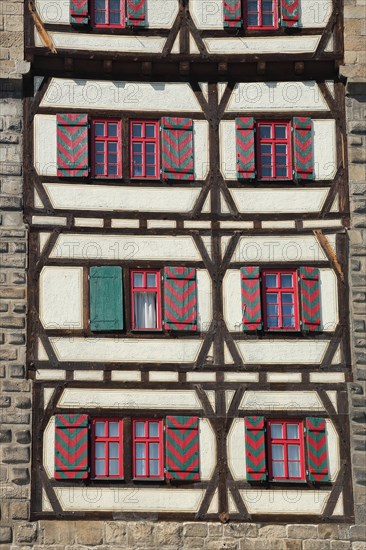House wall of the Gothic Schelztor built in 1228 with shutters and half-timbering