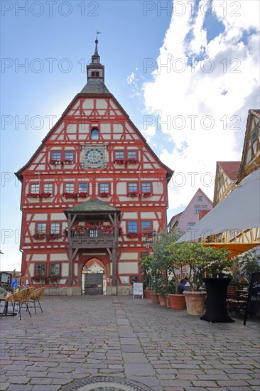 Historic town hall on the market square with street pub