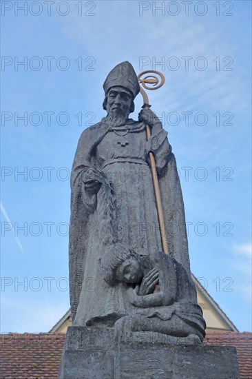 Saint with bishop's crook and child