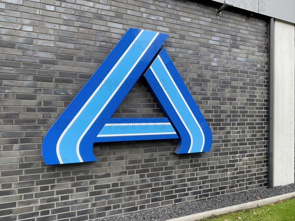 Perspective photo of logo A in blue without lettering on wall of supermarket of retail chain supermarket Aldi Nord
