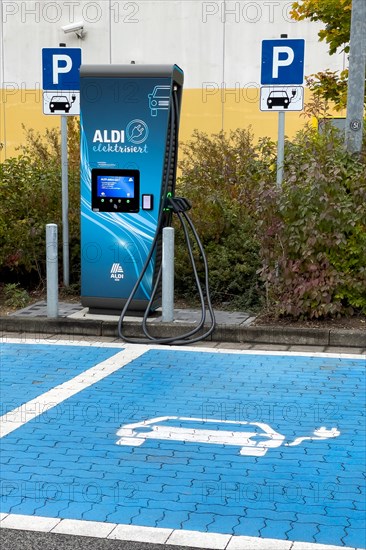 Charging station for e-car in front of supermarket of supermarket chain Aldi Sued next to it traffic sign Parking spaces for two e-cars can be charged