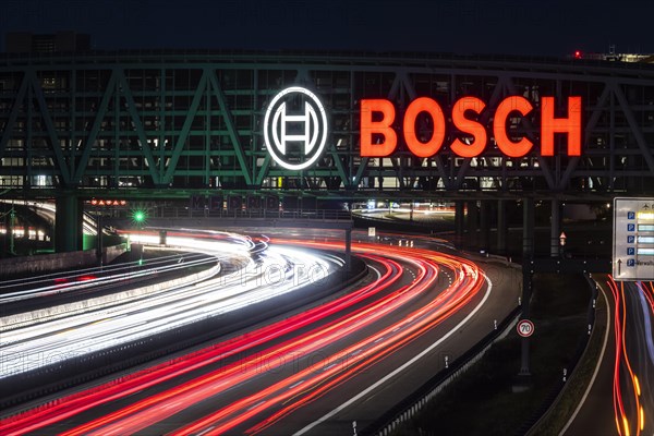 A8 motorway at Stuttgart Airport with Bosch multi-storey car park. The 440-metre-long structure provides space for 4200 vehicles. Bosch has the naming rights