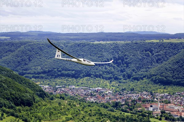 Glider flying over Unterlenningen in the Swabian Alb