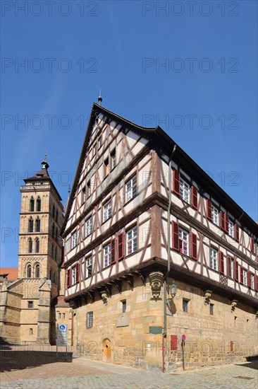 Half-timbered house Sektkellerei Kessler and steeple of the Gothic town church St. Dionys