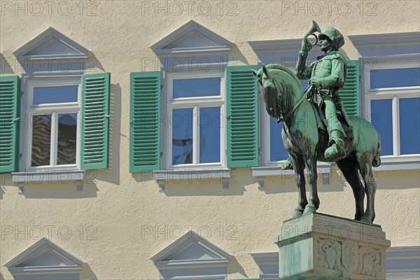 Equestrian figure with post horn in uniform