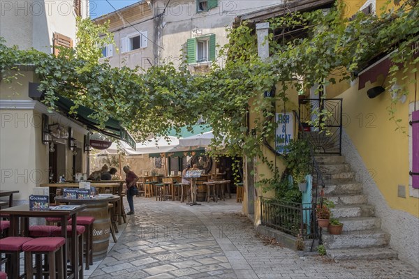 Old town alley with restaurants