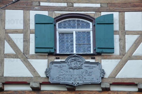 House facade and memorial plaque with inscription to Friedrich Schiller