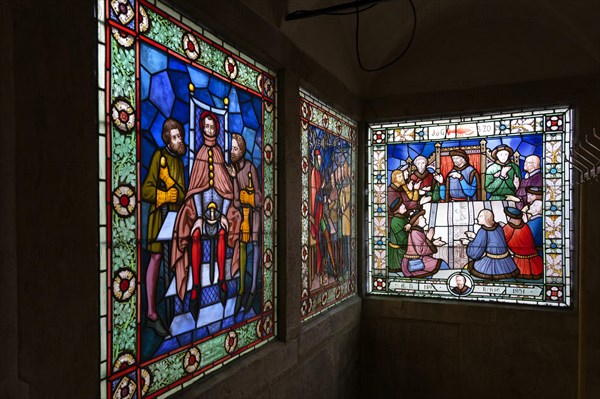 Stained glass in front of fresco hall