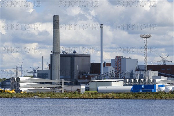 Rotor blades for wind turbines lie in the industrial harbour