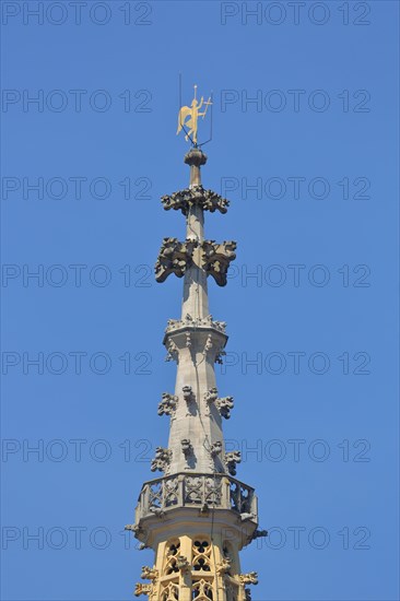 Spire of the Gothic Church of Our Lady built in 1321 with golden angel as weather vane