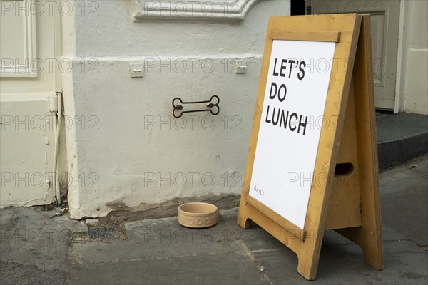 Entrance to restaurant with water bowl for dogs