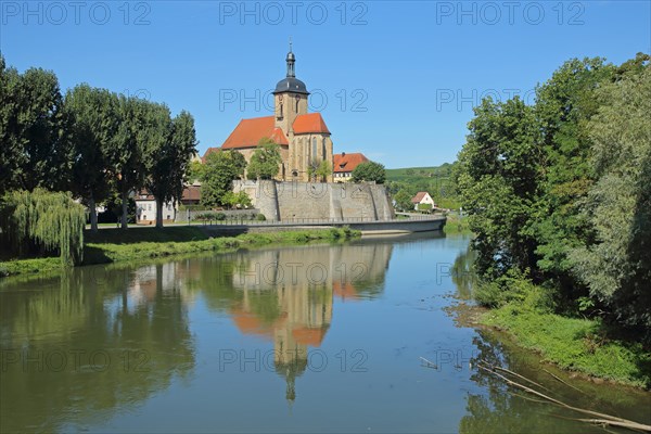 Romanesque Regiswindis Church with reflection in the Neckar