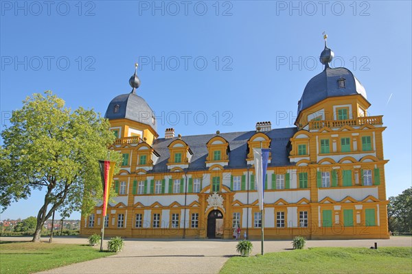 Baroque Seehof Castle with German national flag and Bavarian state flag