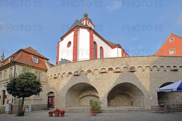 Stone wall with archways and St. Augustine's Church