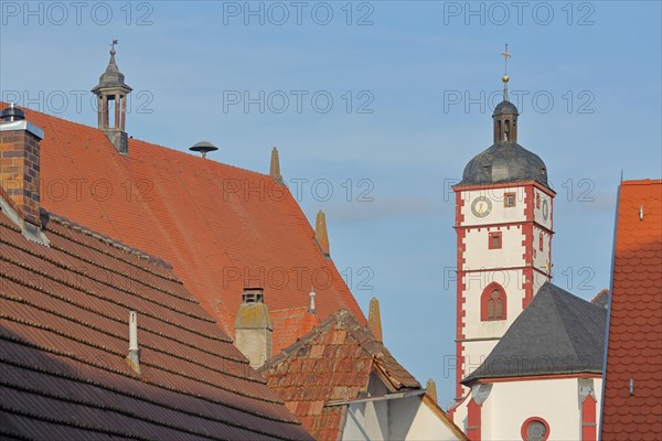 Tower of the baroque St. Augustine Church and roof of the town hall
