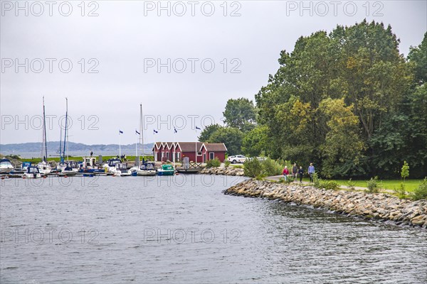 Jetty at Rune's Lighthouse with typical Swedish boathouses