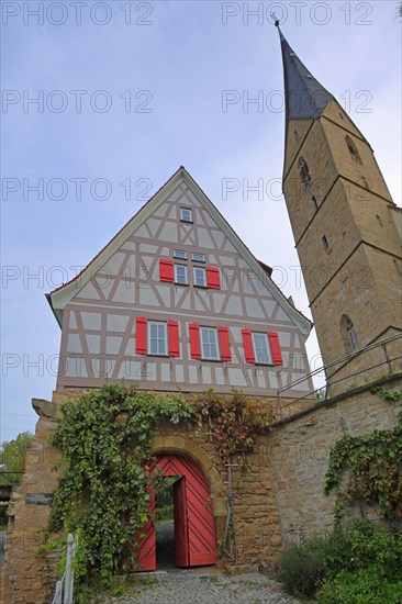 Rectory with archway and steeple of the late Gothic Alexander Church