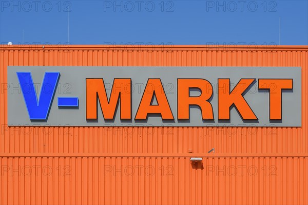 Orange facade with logo and lettering