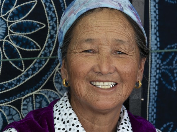 Saleswoman in her shop for clothes and cloths