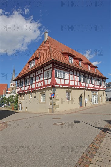 Half-timbered house and church tower