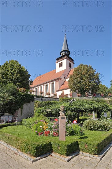 Monument to historian Josef Hemmerle and Holy Trinity Church