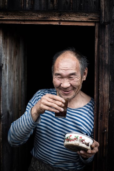 Hermit in front of his hut